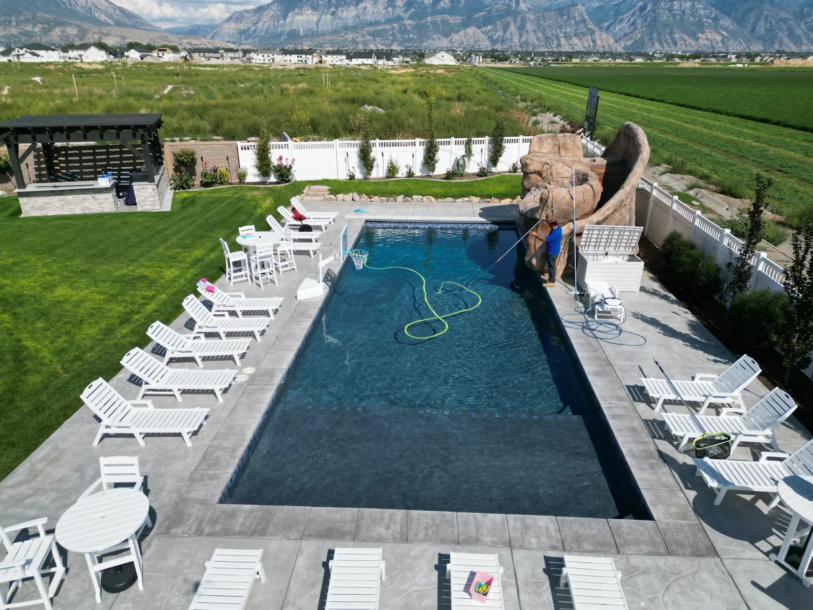 Aerial view of a maintained pool below the Wasatch mountains